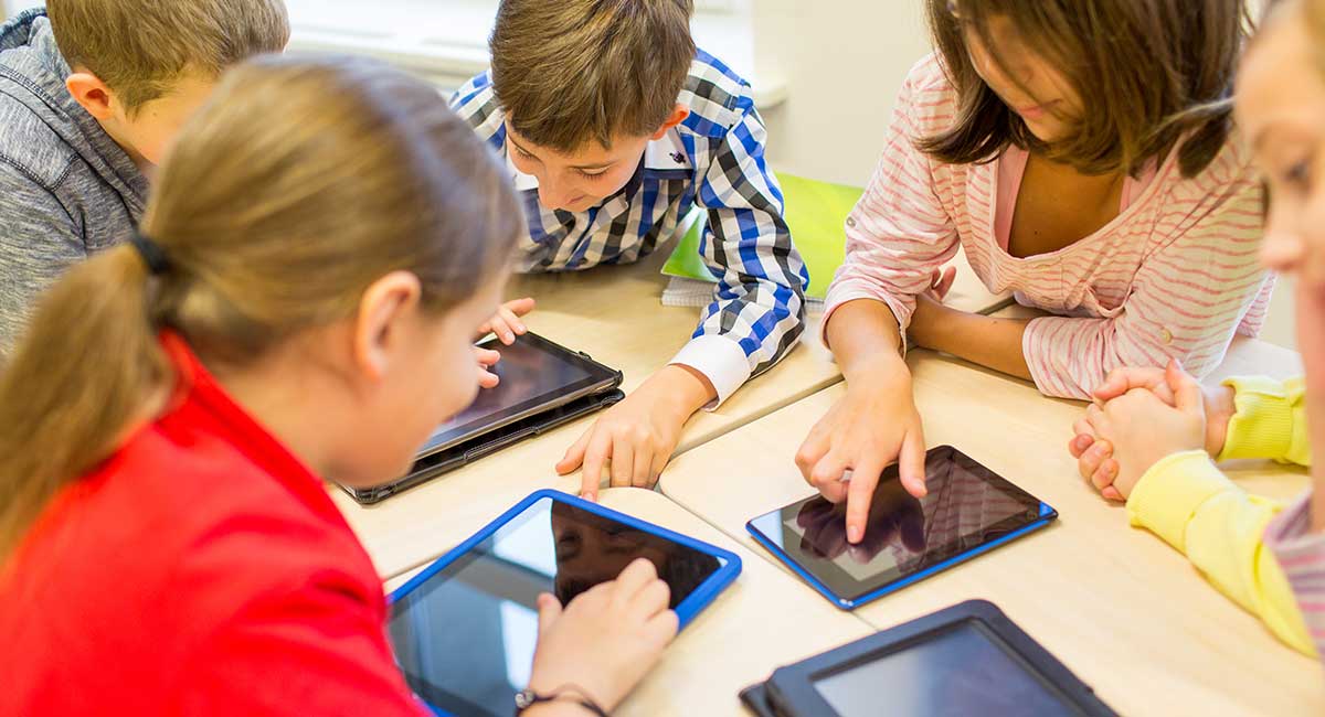 students using edtech apps on tablets