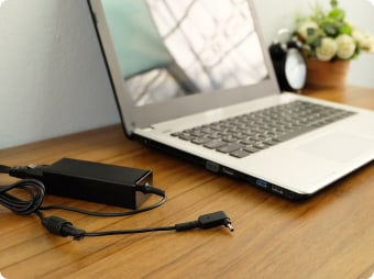 close up of laptop and charger