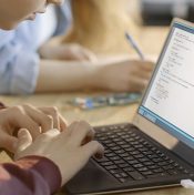 student doing homework on computer