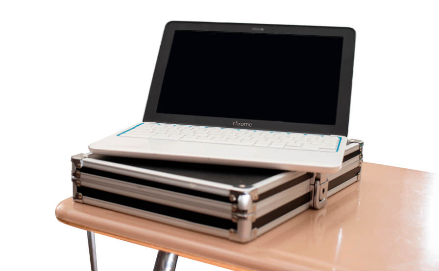 Chrome book on top of brief case