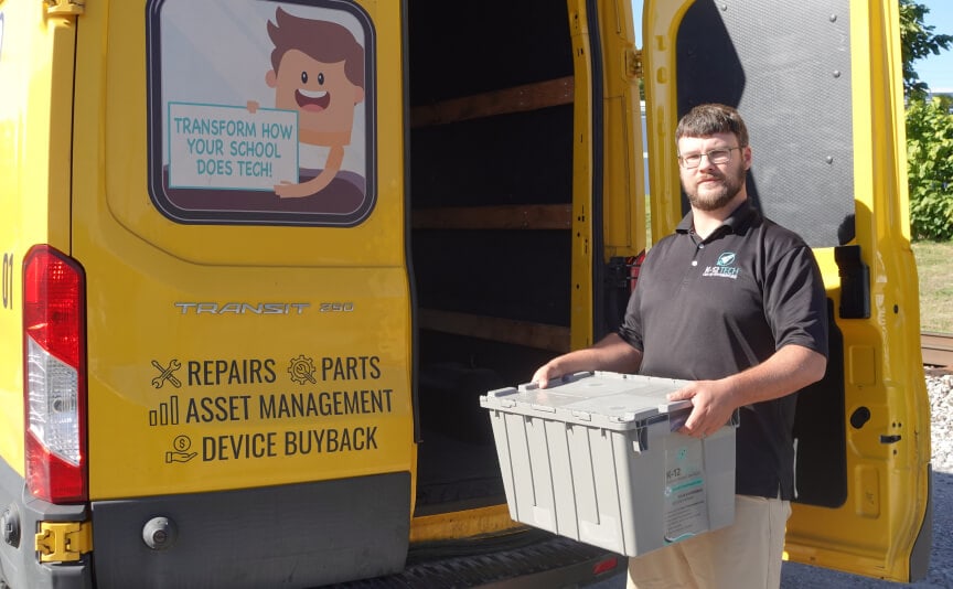 K-12 Tech driver delivering repaired devices