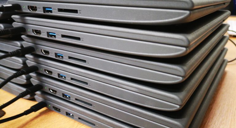multiple chromebooks in a pile