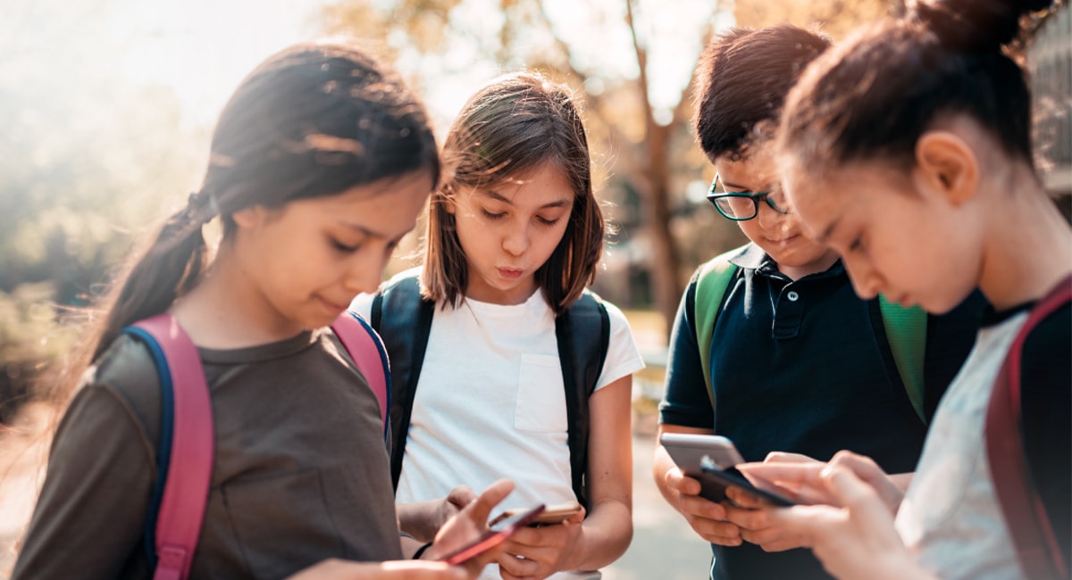 multiple kids using their cellphones